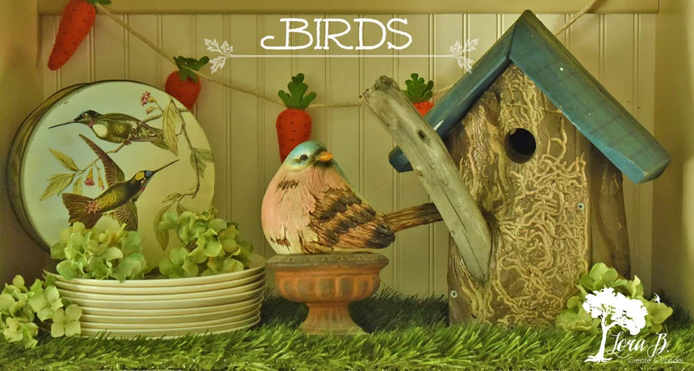 Birdhouse and bird on spring shelf