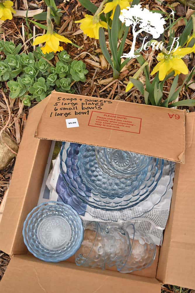 Box of blue bubble vintage dishes.