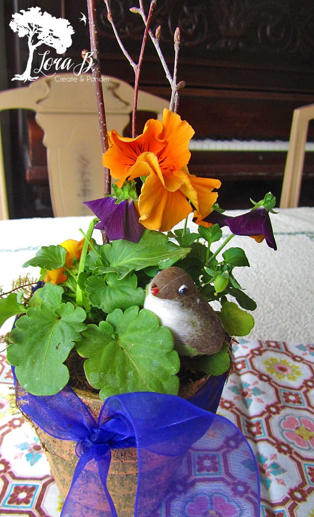 Pansy Pot arrangement with bird.