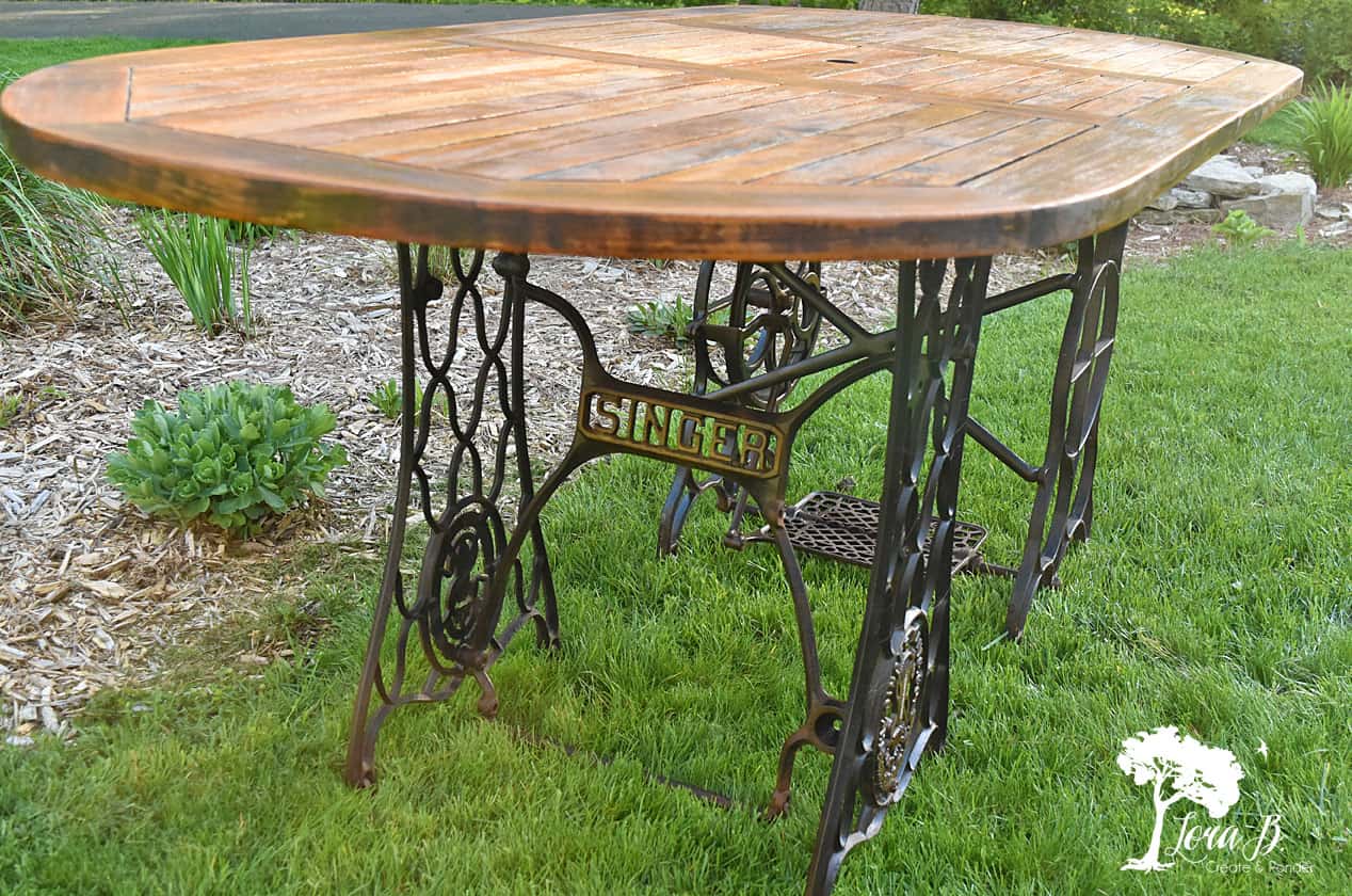 Singer sewing machine base for a table