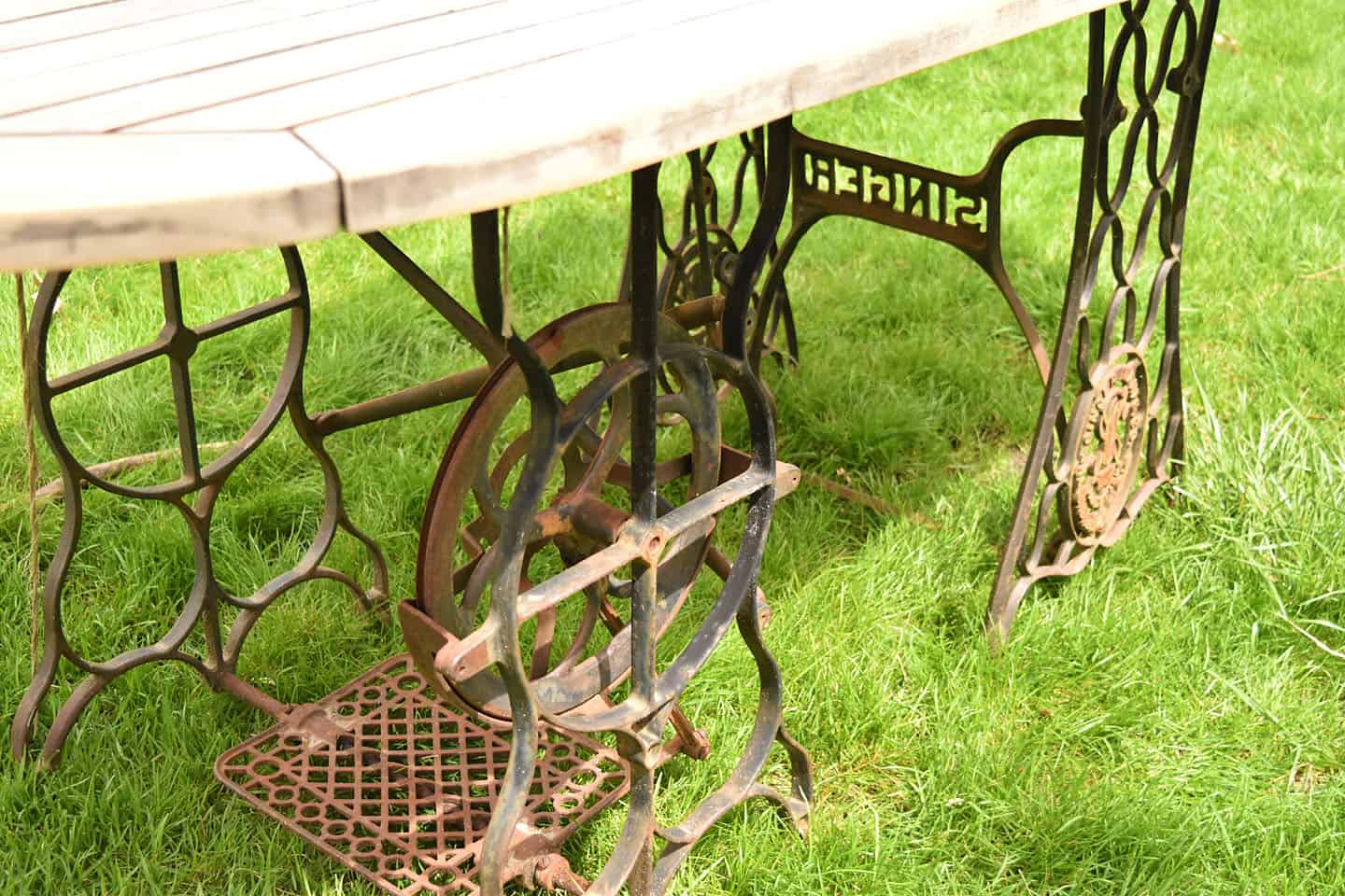 Industrial desk made from antique Singer sewing machine treadle bases.