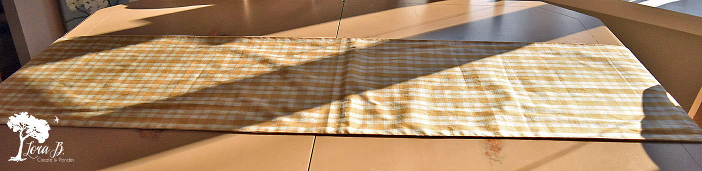 Plaid table runner as tablescape foundation
