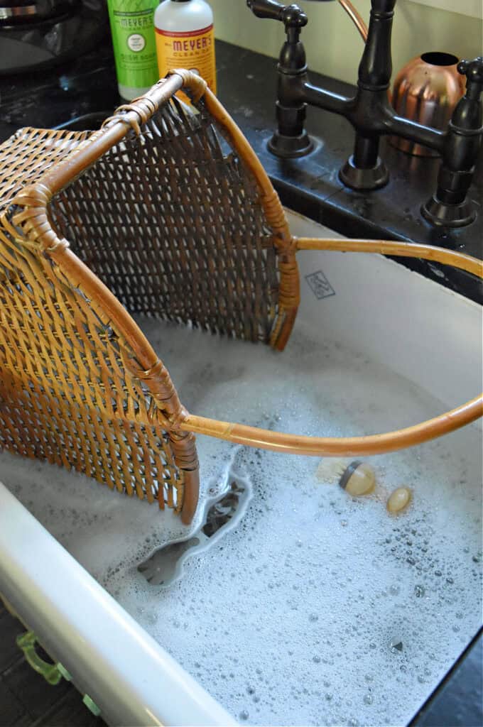 Washing a wicker basket.