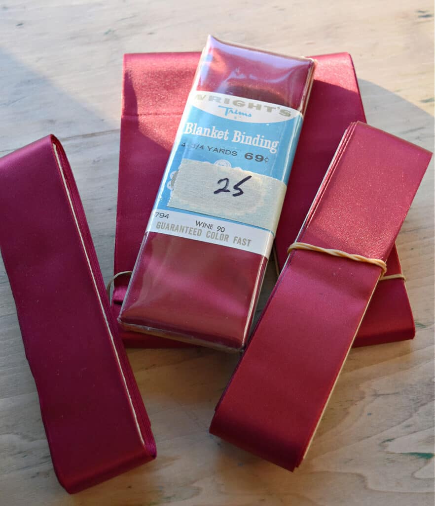 Vintage red satin blanket binding.