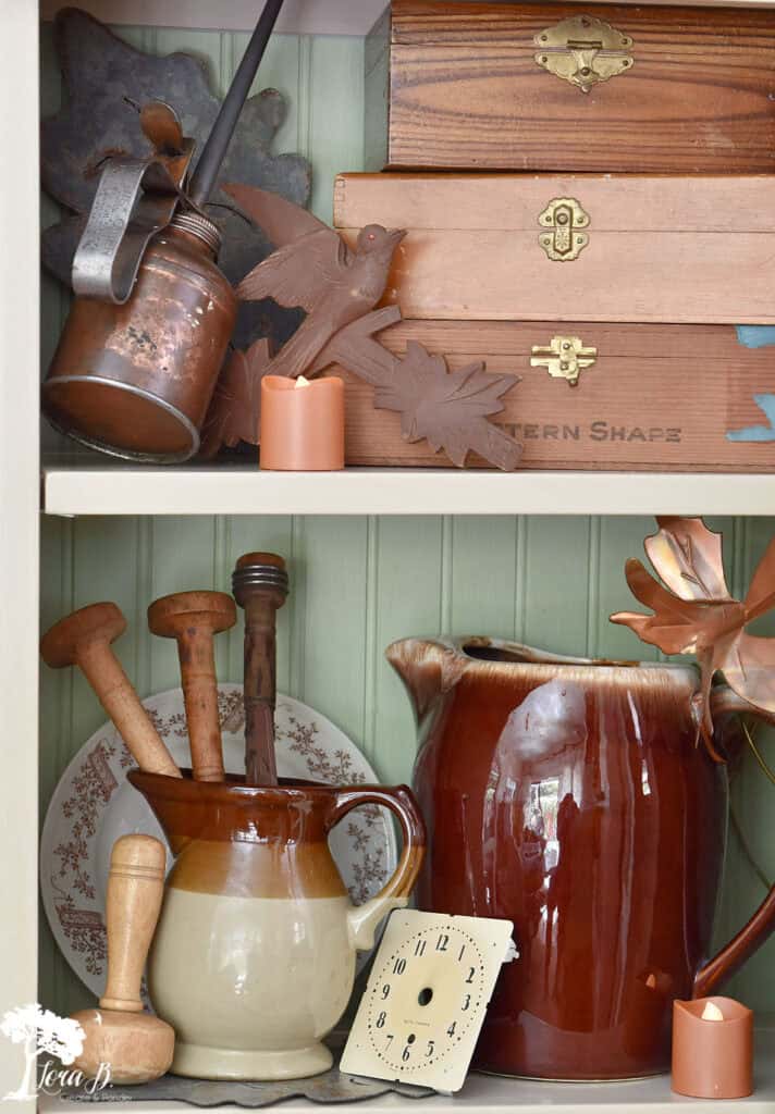 Brown pottery pitchers and brown vintage vignette.