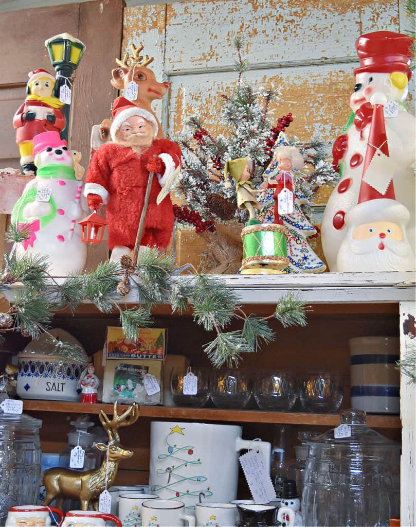 Christmas items on antique store shelves.