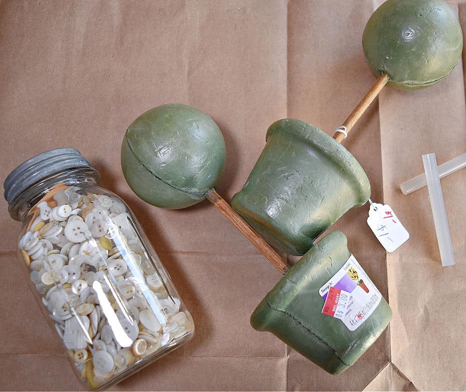 Old buttons and styro topiary forms for crafting.