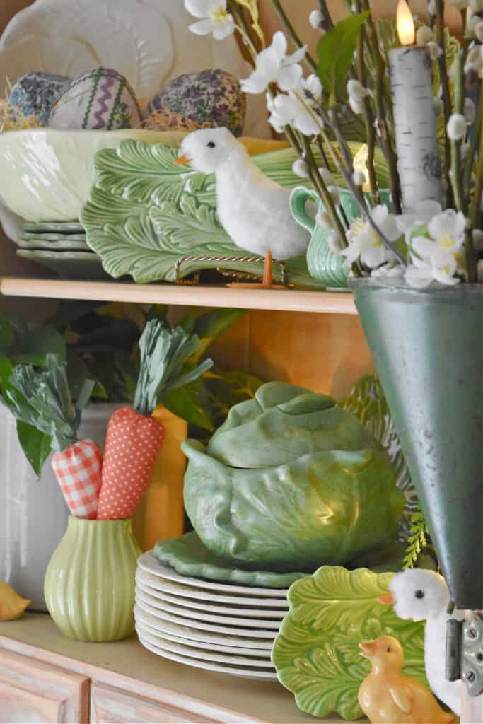 Spring hutch decor with vintage cabbage ware.