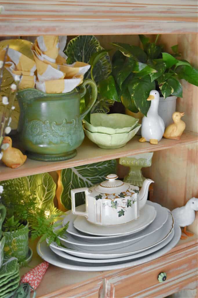 Spring hutch decor with cabbage ware.