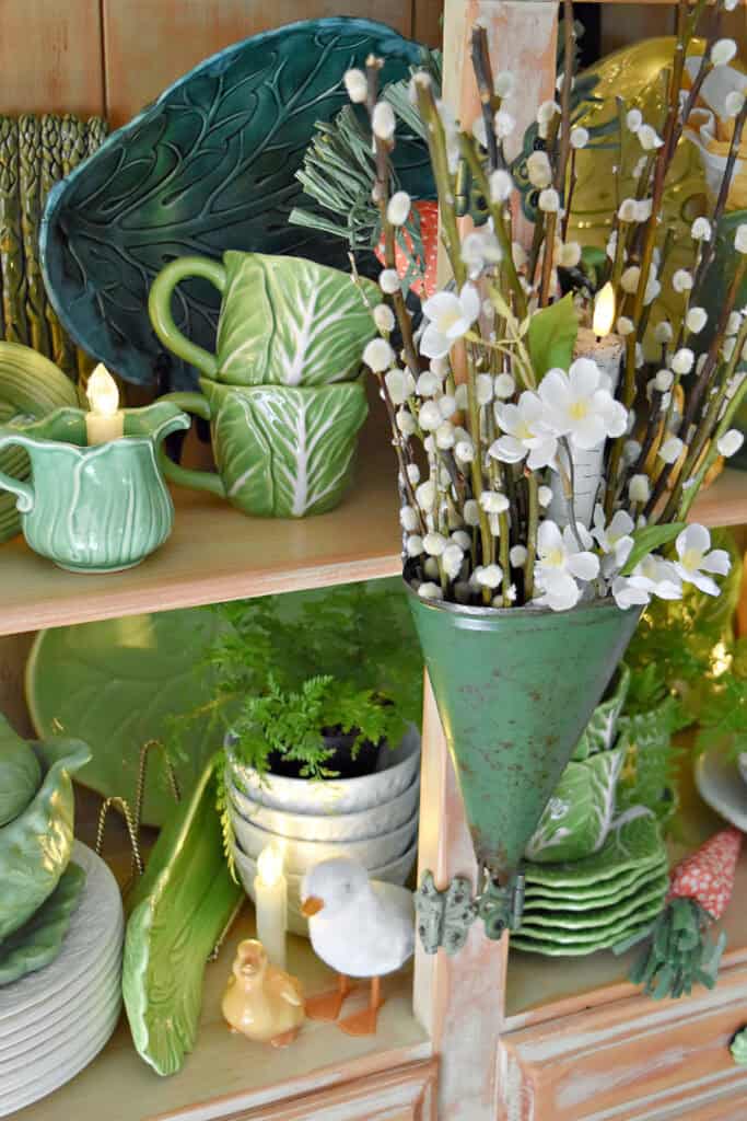 Spring hutch decor with cabbage ware.