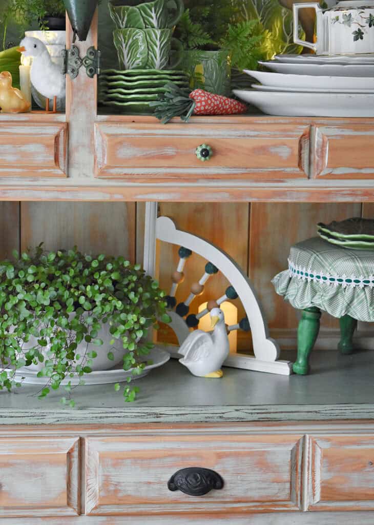 Spring hutch decor with cabbage ware.