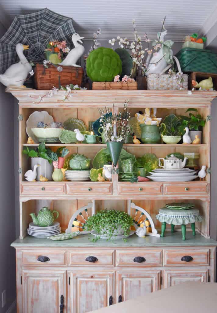 Spring hutch decor with cabbage ware.