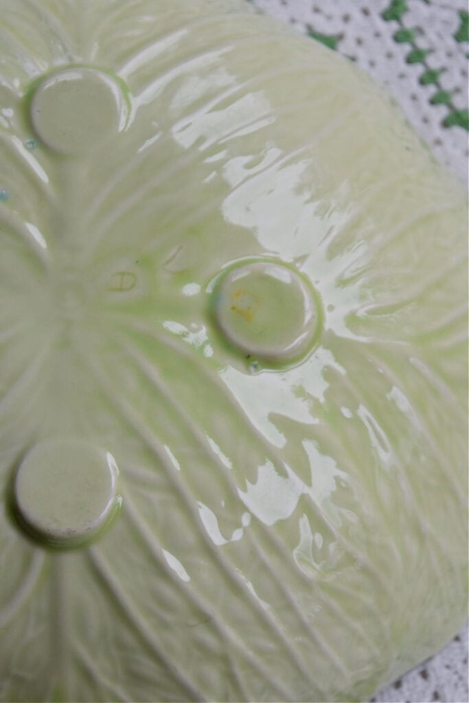 Initials on back of cabbage ware bowl.