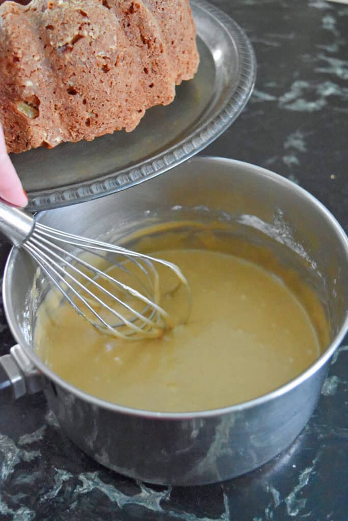 Whisking frosting for Caramel Apple Cake.