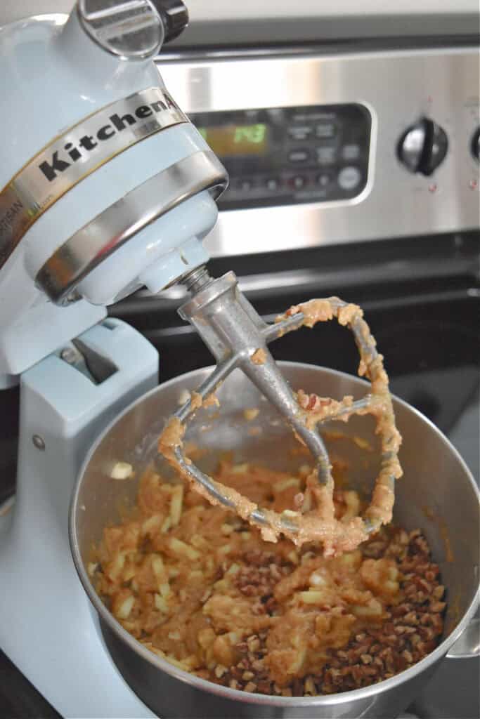 Mixing homemade apple cake ingredients.