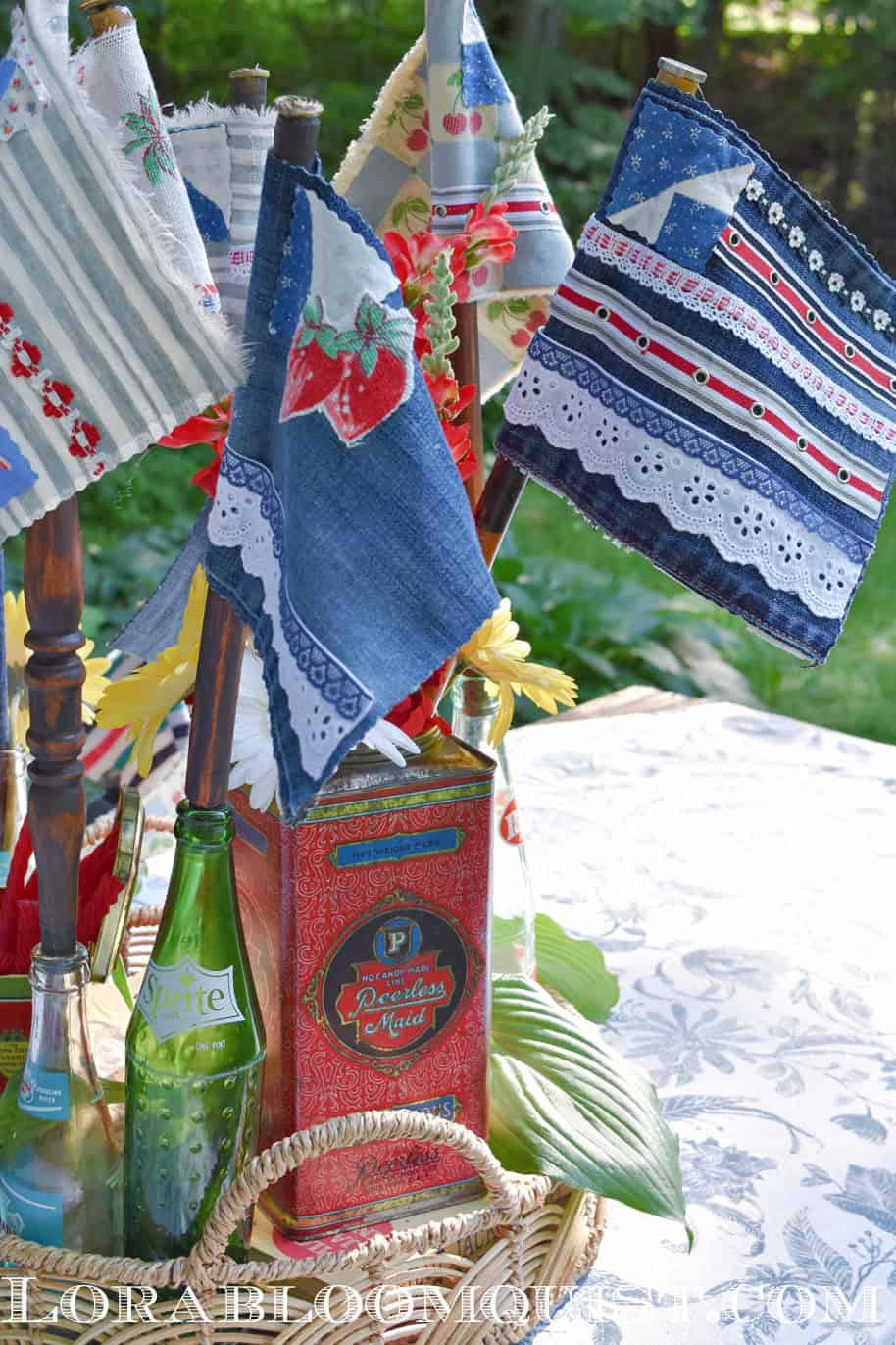 Denim scrap fabric flags in old soda bottle and tin.