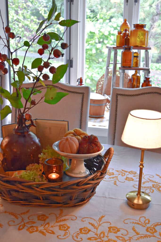 Collected look Fall centerpiece in a basket tray.