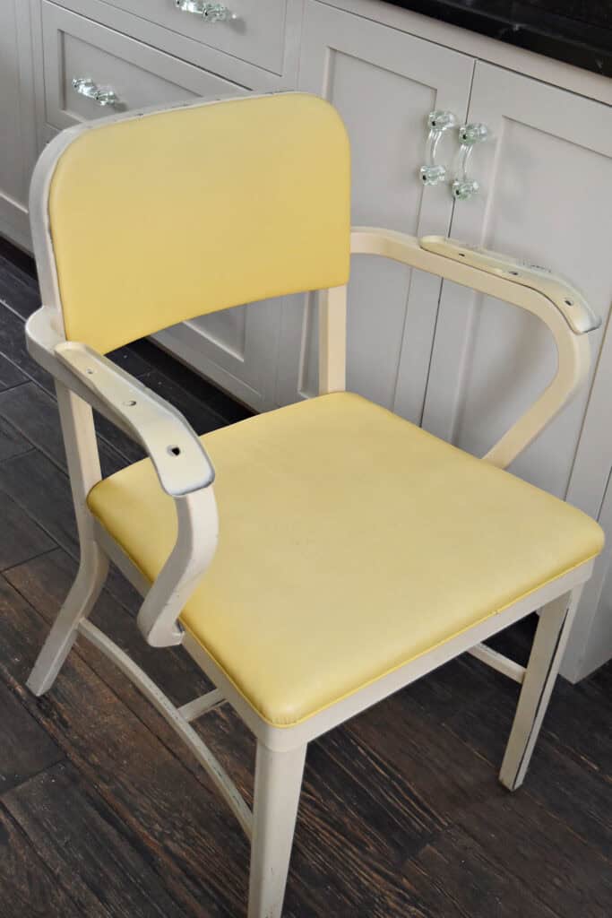 Vintage industrial yellow chair being refreshed.