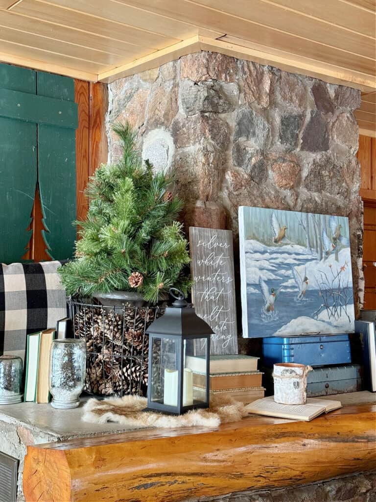 Vintage decor decorating stone cabin mantel.