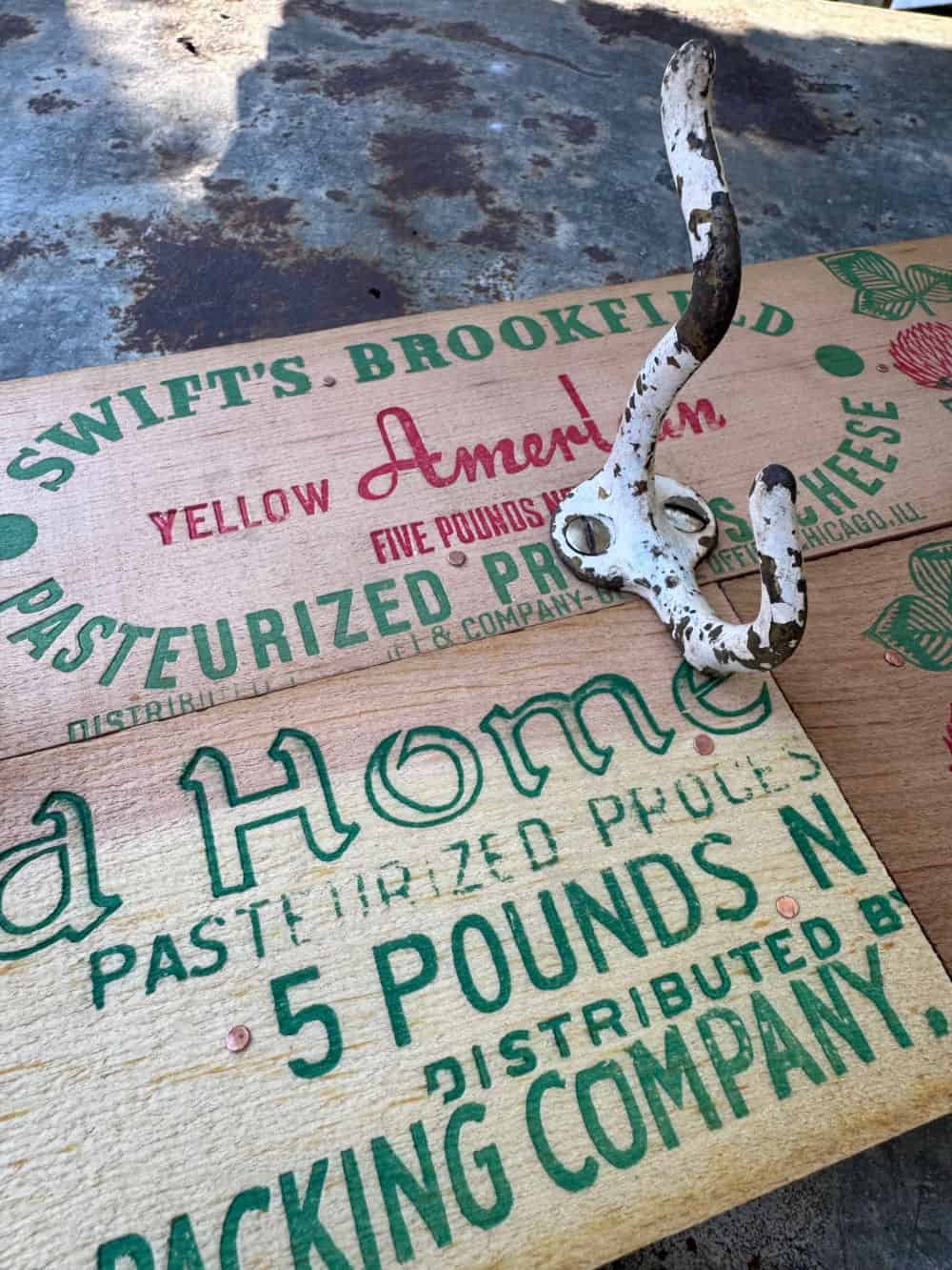 Old hook on vintage cheese box sides.