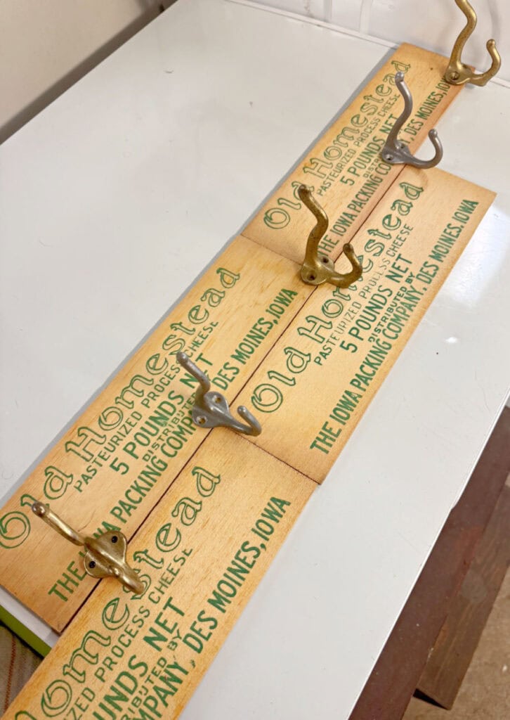 Vintage cheese box graphics get upcycled into nostalgic hooks.