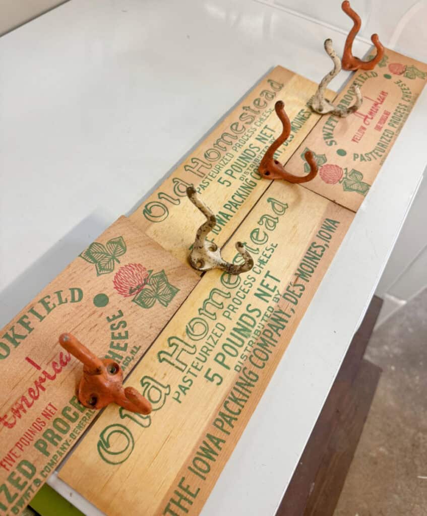 Vintage cheese box graphics get upcycled into nostalgic hooks.