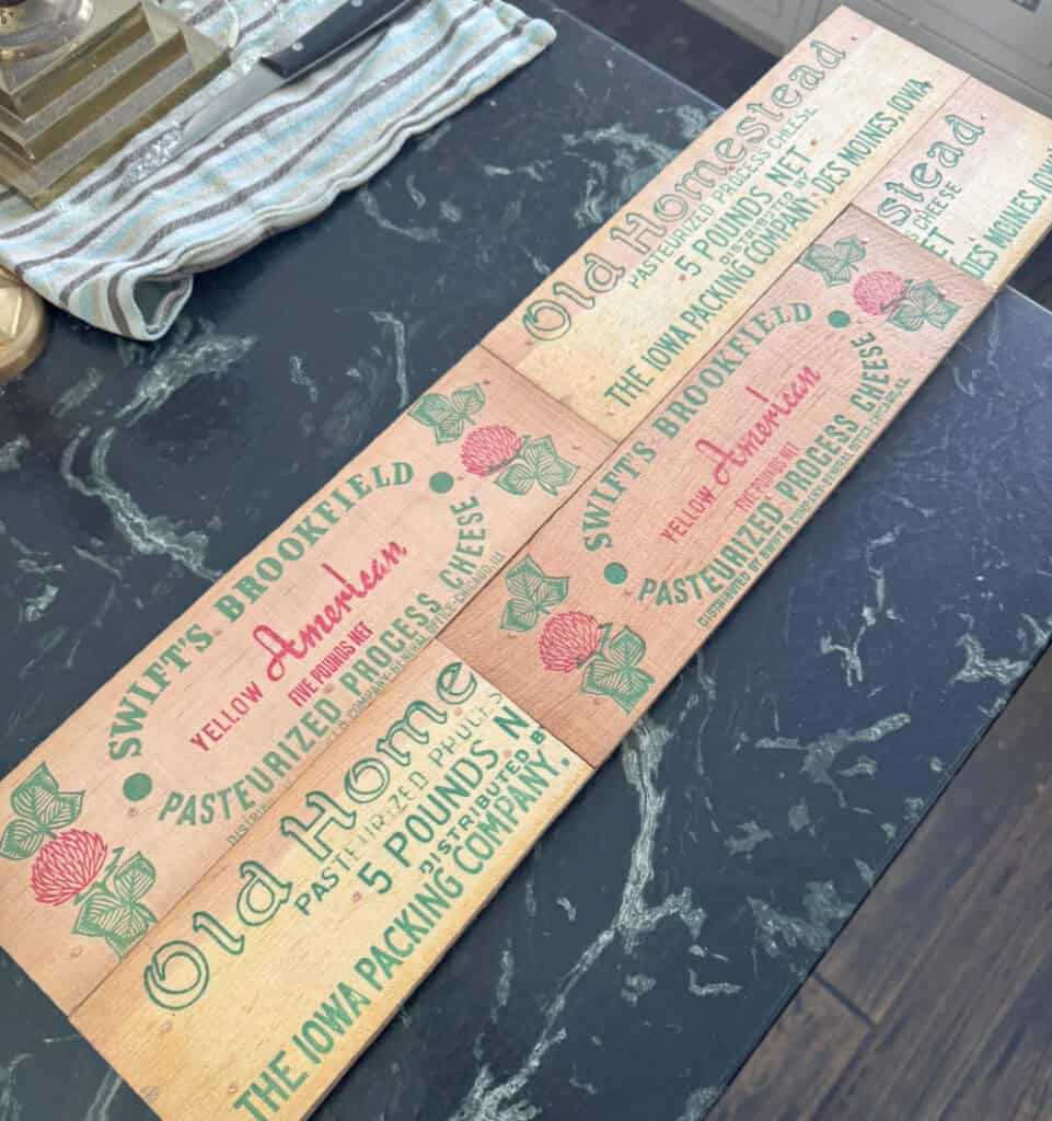 Vintage cheese box graphics get upcycled into nostalgic hooks.