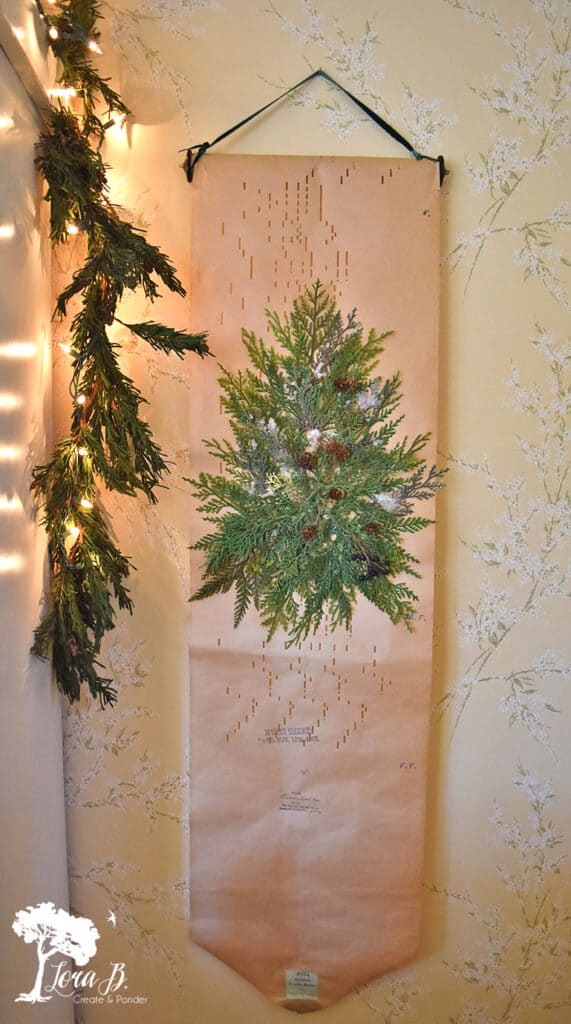 An old player piano roll becomes a pretty Christmas decor in a vintage decorated bedroom.