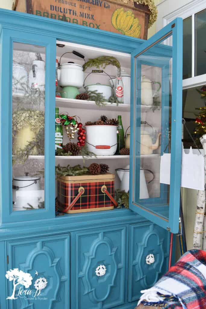 Vintage Christmas decor in cabinet