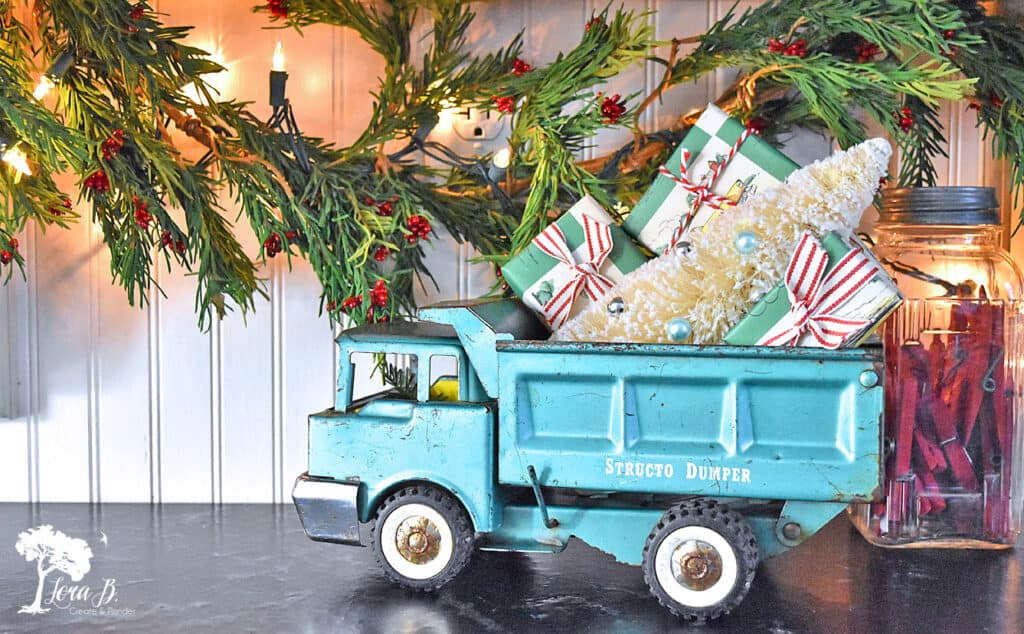 Vintage toy truck with mini Christmas packages.