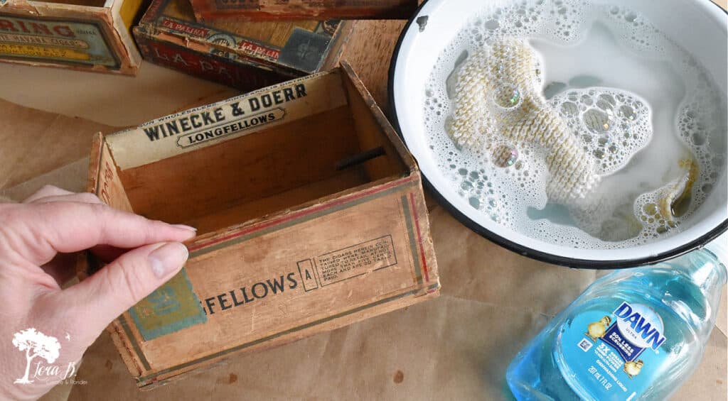 Old cigar box being cleaned