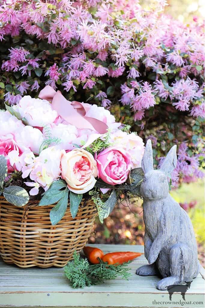 Bunny statue by flowers