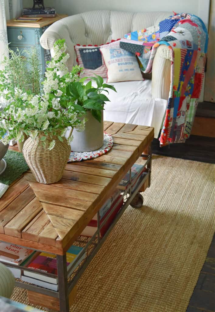 Industrial coffee table with summer vignette.