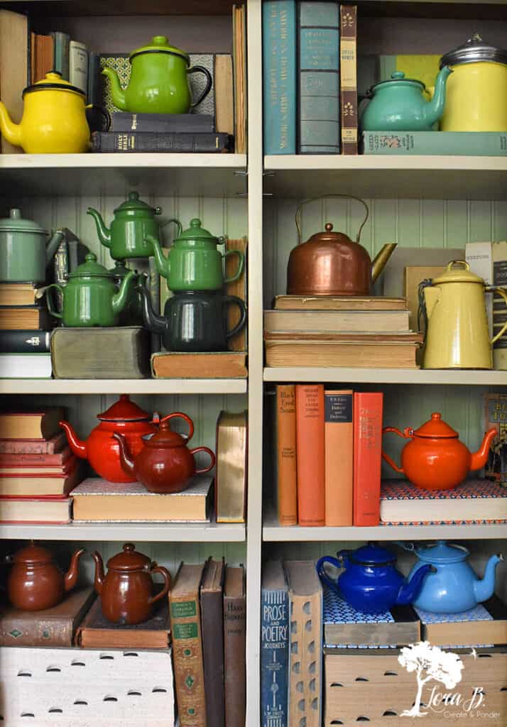 Vintage teapot collection displayed creatively.