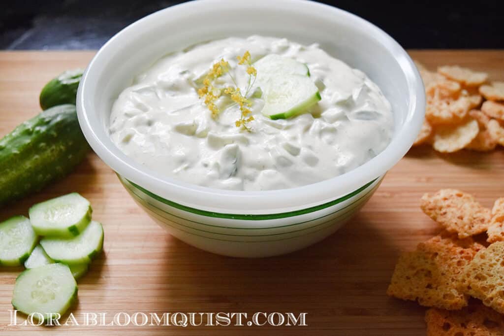 Dill Cucumber dip on vintage bowl, served with cracker crisps.