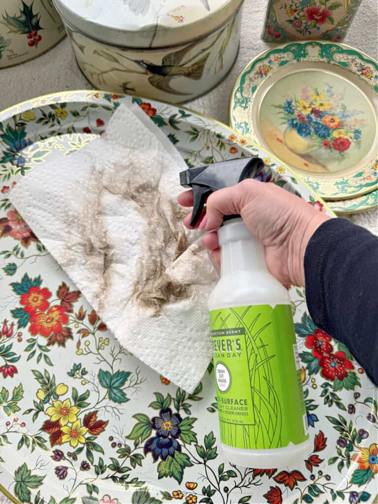 Cleaning metal tin tray.