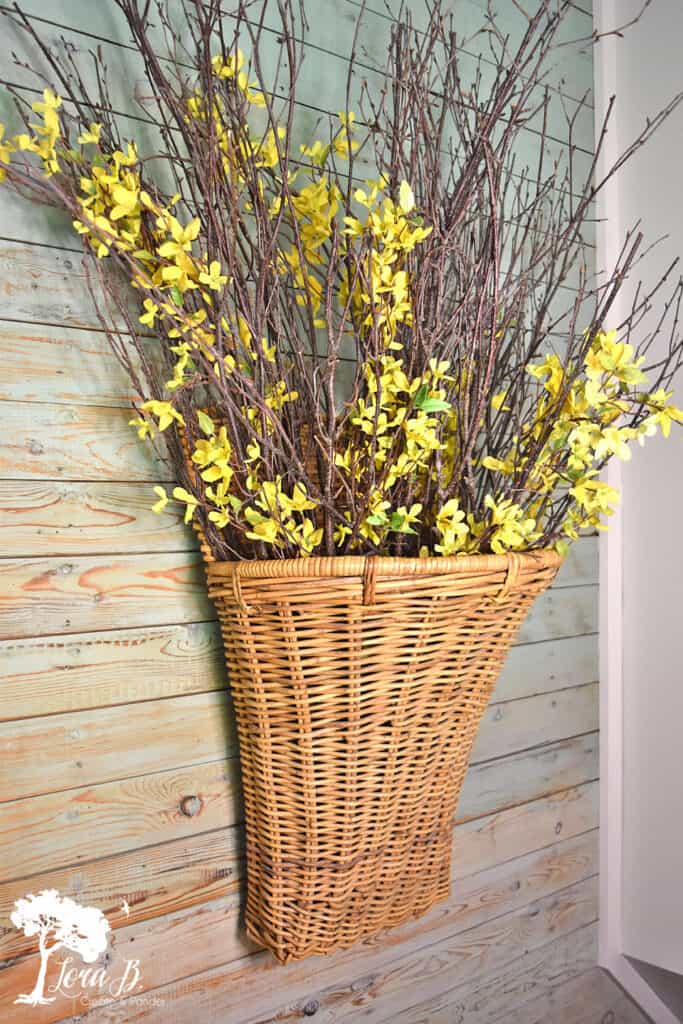 Branches in a basket can easily be transitional decor through the seasons.