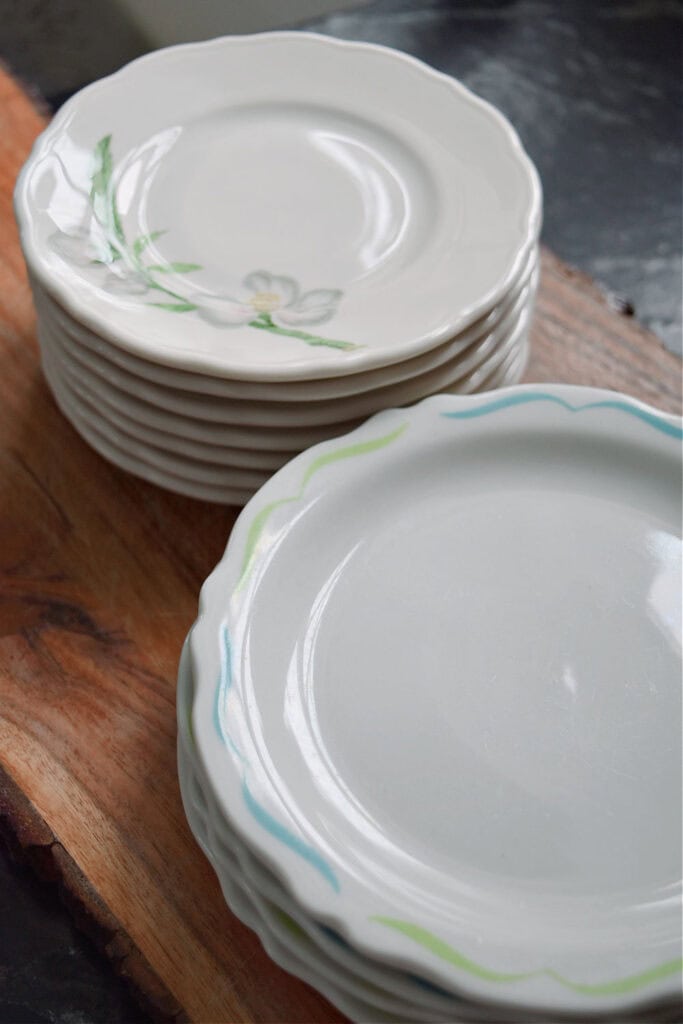 Stacks of vintage hotelware dishes.