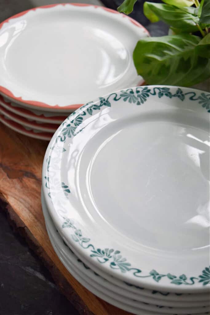 Stacks of vintage restaurant ware dishes.