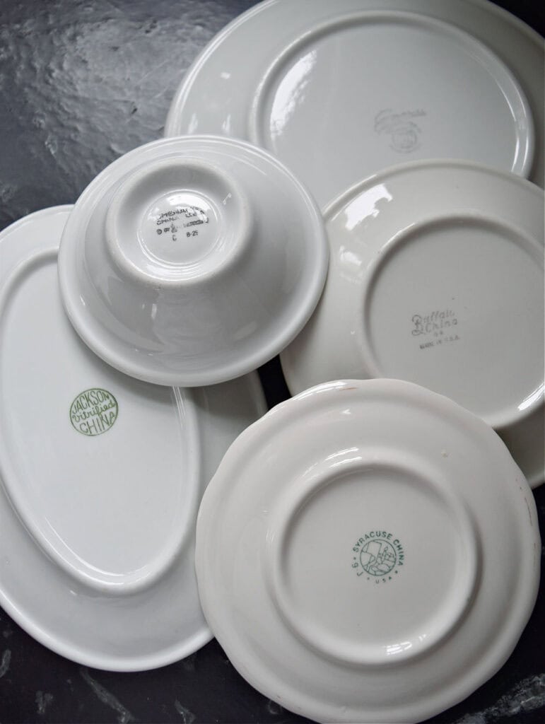 Hotelware dishes with maker labels.