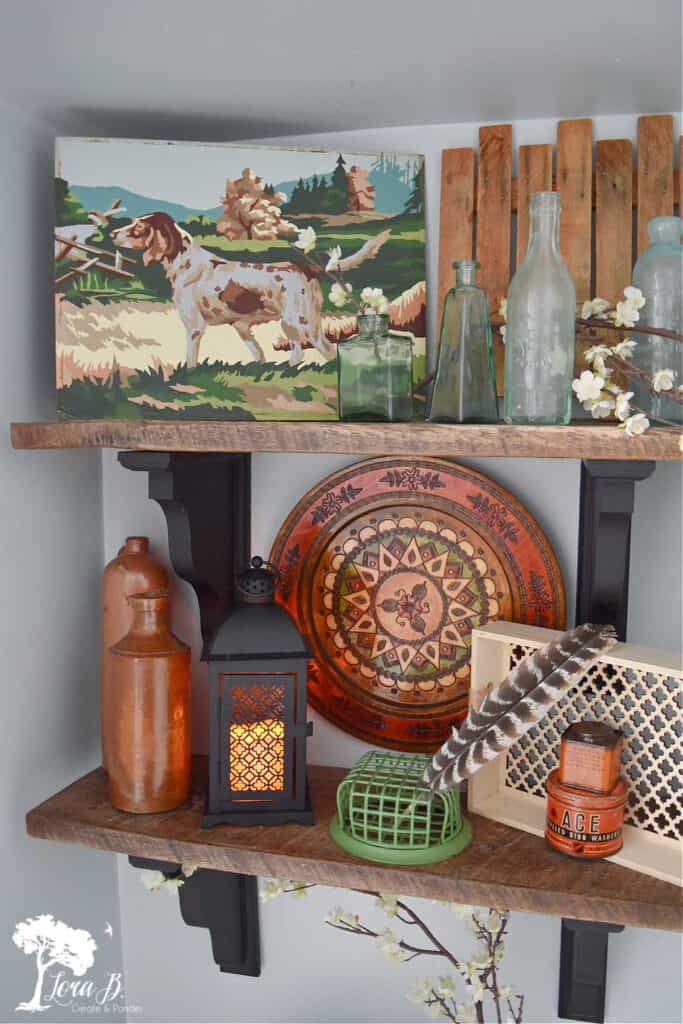 Vintage and new accessories on a bathroom shelf