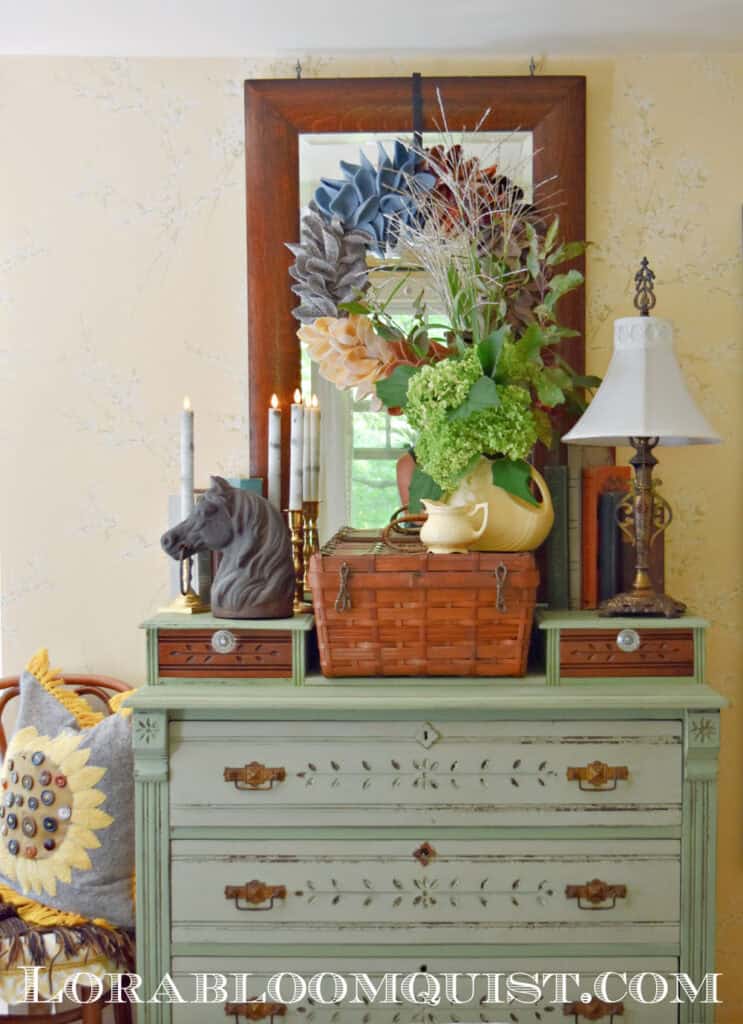 Green painted dresser with Fall decorating.
