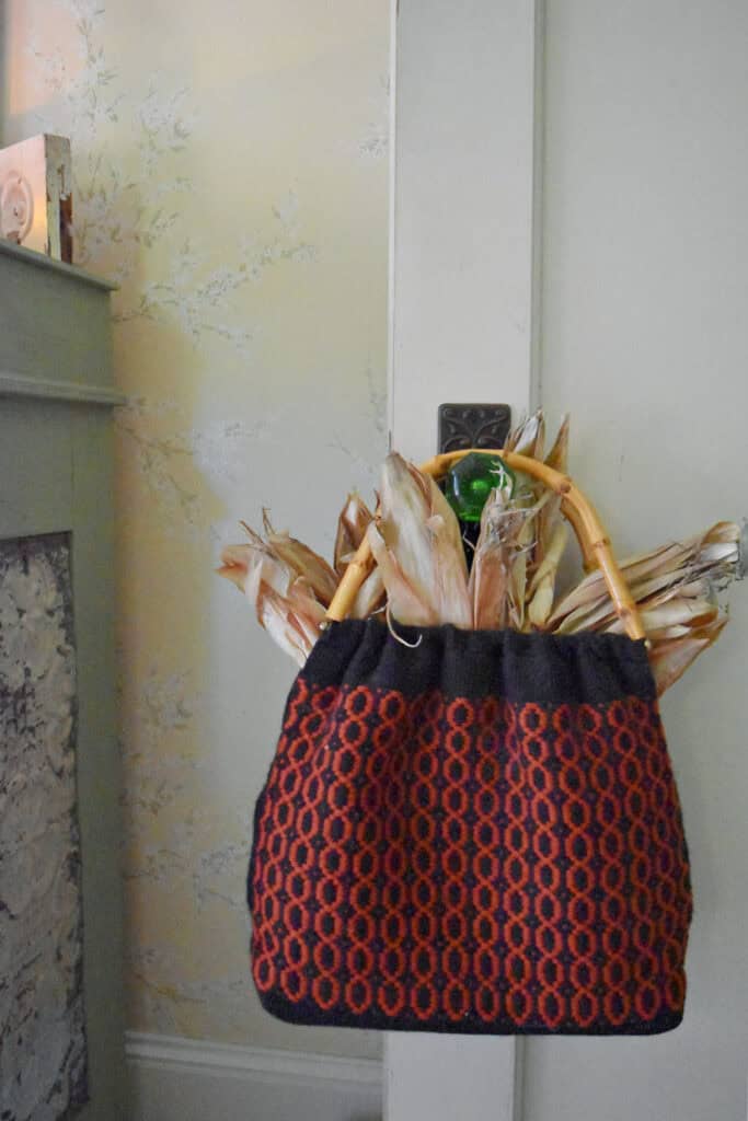 Vintage handmade purse in orange and black.