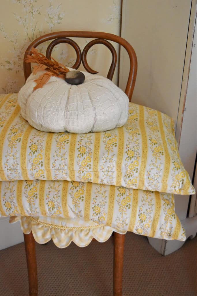 Vintage yellow stripe ticking pillows.