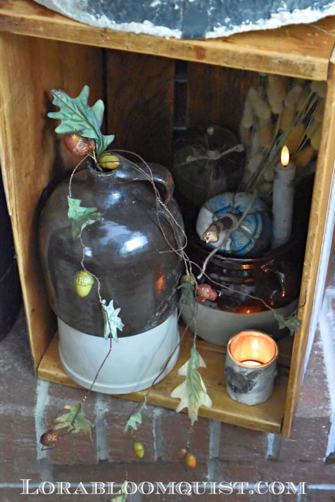 Stoneware jugs as Fall decor on mantle.