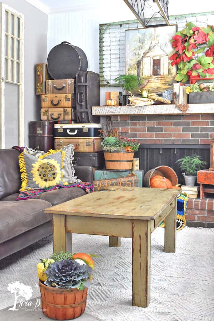 Vintage and rustic accessories combine for a decorated Fall Mantel display.