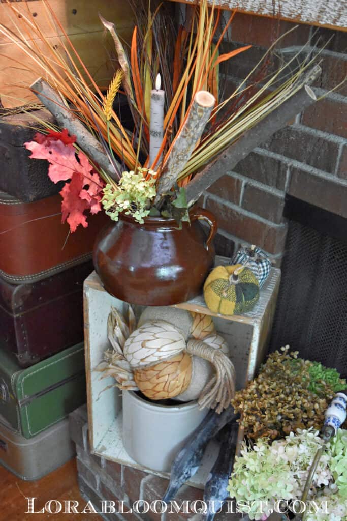 Vintage stoneware as Fall mantel decor.