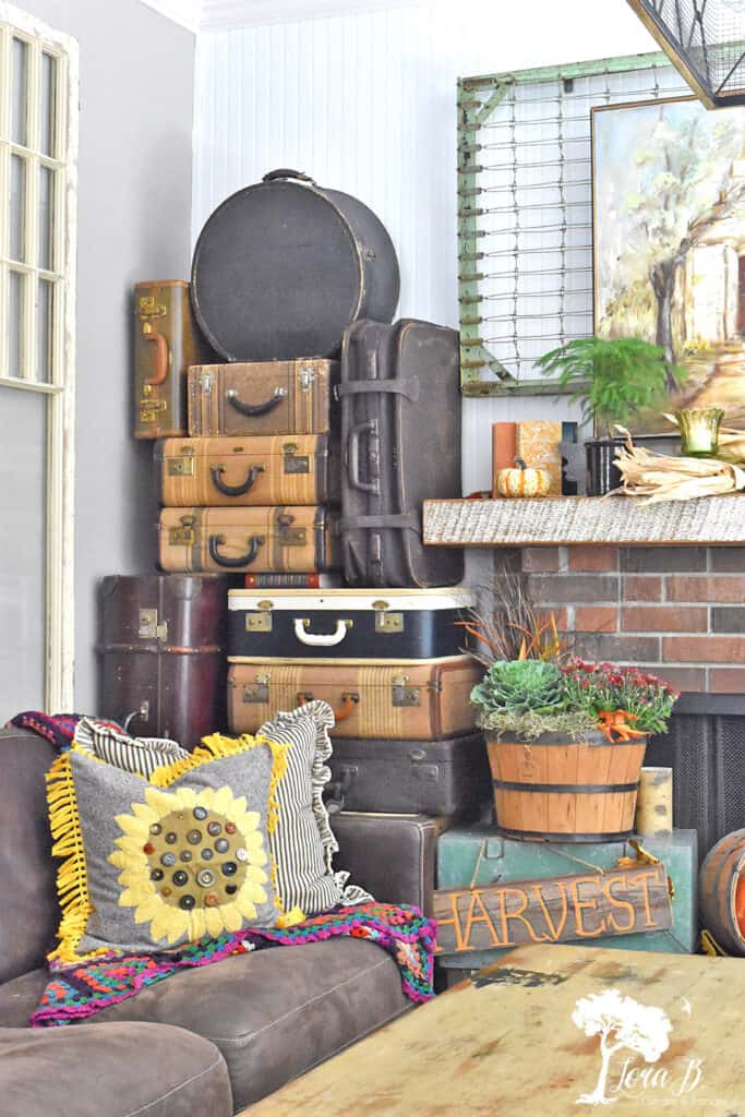 Vintage suitcase collection decorate a Fall Mantel display.