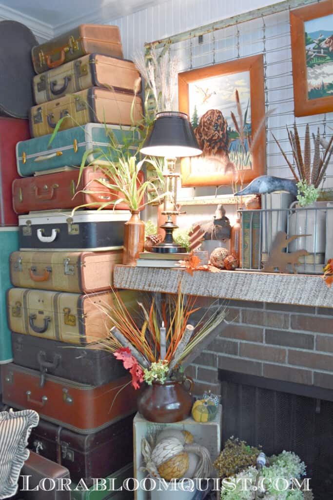 Vintage suitcases stacked to ceiling as Fall home decor.