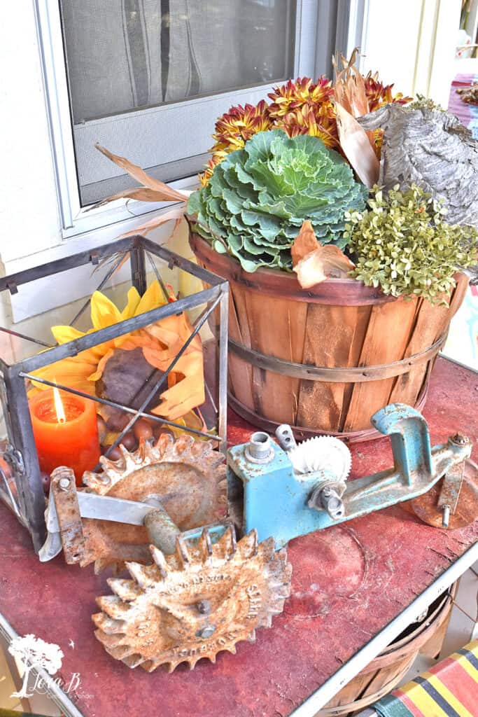 Vintage tractor sprinkler on a fall decorated porch and patio tour.